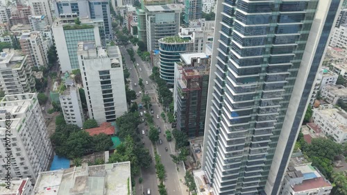 City Skyline Aerial View with Modern Skyscrapers, Tree-Lined Streets, and Dense Urban Buildings for Architecture Concepts