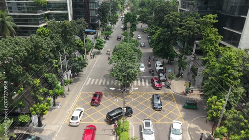 Street Cityscape Aerial View with Green Trees, Buildings, and Cars Creating a Calm Urban Transport Scene