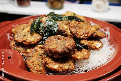 Fresh fried fish paste balls with crispy rice vermicell in red plate