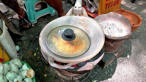 Kerak telor is a dish from the Betawi (Jakarta, Indonesia), consisting of an omelet mixed with white glutinous rice, dried shrimp, and spices.