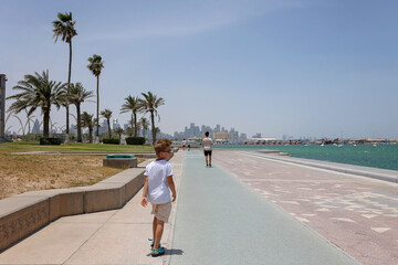 Happy european family, visiting Doha during the hot summer months