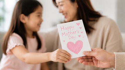Mother daughter card love happy Mother Day family celebration home togetherness smiling Asian