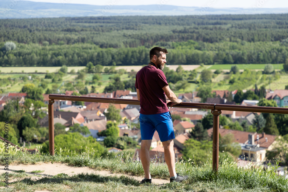 Naklejka premium man relaxing on a summer terrace
