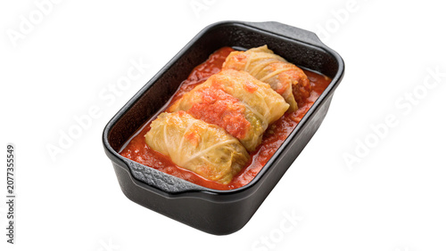 Photos Black baking dish filled with hot stuffed cabbage rolls in sauce isolated on tra
