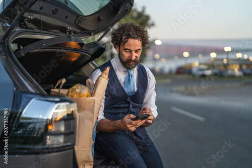Canvastavla Man connecting with smart phone after grocery shopping trip