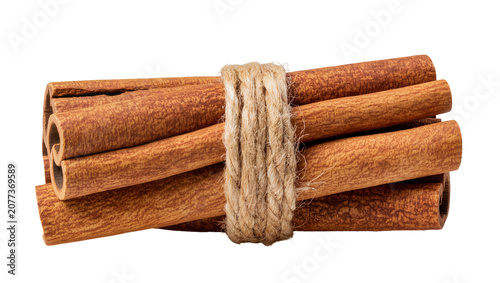 Cuadro en lienzo Bundle of cinnamon sticks tied with rough jute twine