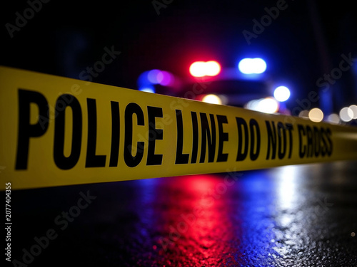 Police Line Do Not Cross Tape at Night Crime Scene