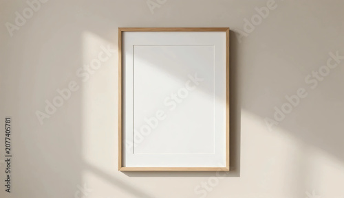 Empty wooden frame mockup on beige wall with soft sunlight shadow, minimalist