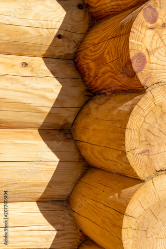 a corner of a house made of pine, log cabin