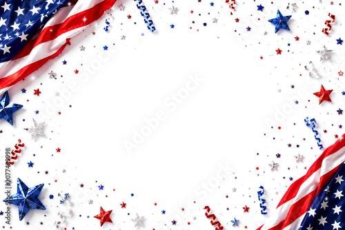 Close up folded American flag atop sun faded campaign poster with textured paper and visible fabric weave invoking historic Fourth of July mood