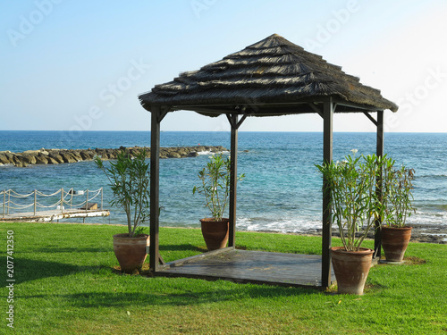 Beautiful landskape, palm trees and sun loungers at luxury resort