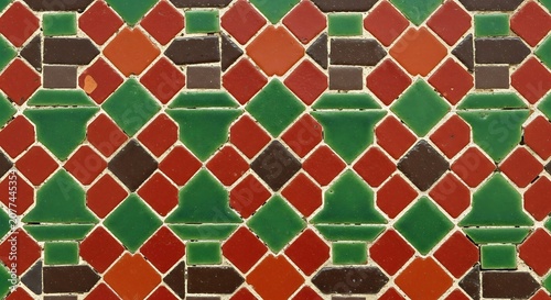 Geometric pattern with red green and white diamonds.