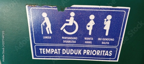 Foto Priority seating sign for elderly, disabled, pregnant women, and mothers