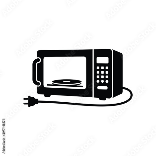 Kitchen microwave oven with cord and plug on white background for food preparation concept