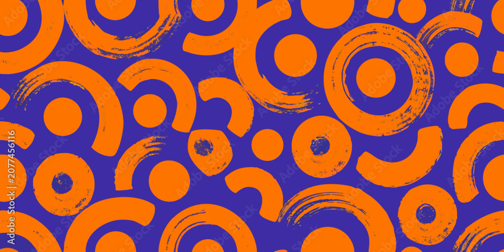 Fototapeta premium Orange circular shapes seamless pattern on purple background
