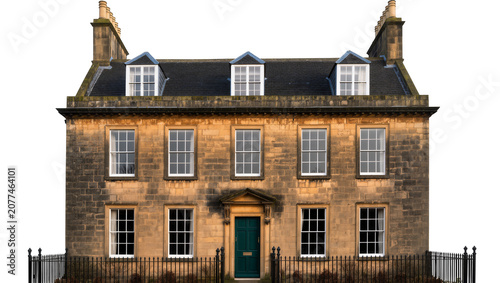 Tableau sur toile Georgian townhouse with stone facade dormer windows, and dark green door