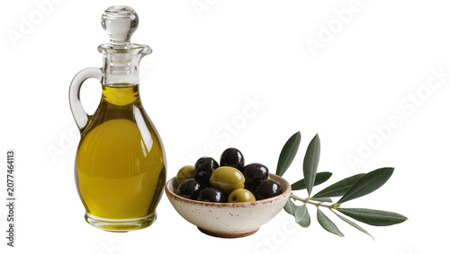 Φωτογραφία Glass cruet filled with golden olive oil next to bowl of olives and branch