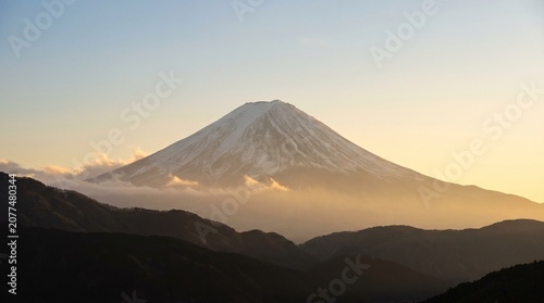 Mount fuji at sunrise with snowcapped peak and surrounding mountains