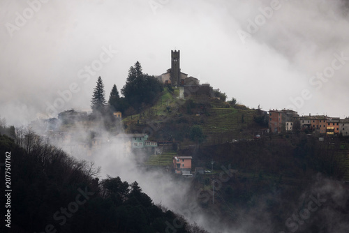 Tower in mist and clouds