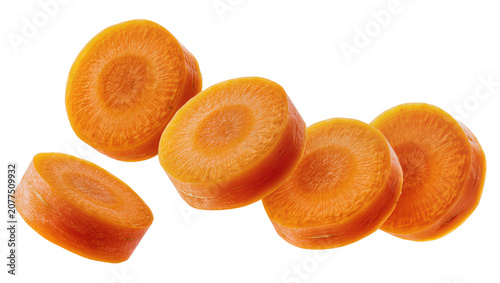 Schilderij op canvas Orange carrot slices with visible texture and core