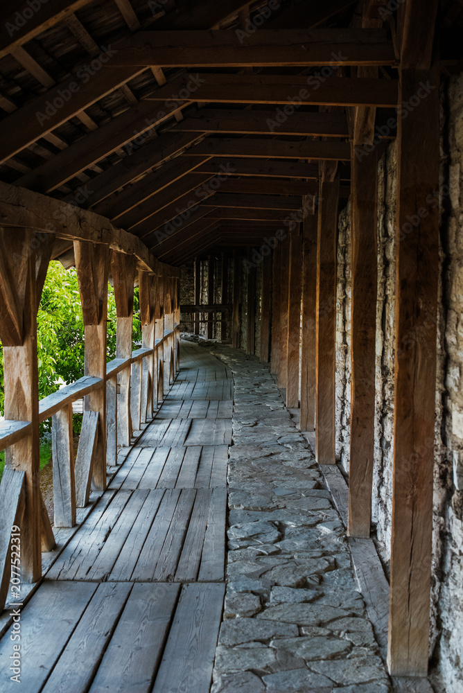 Obraz premium wooden gallery along the stone wall of the old Kamianets-Podilskyi fortress