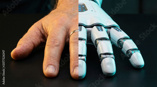 Human male hand merging with advanced robotic bionic arm.