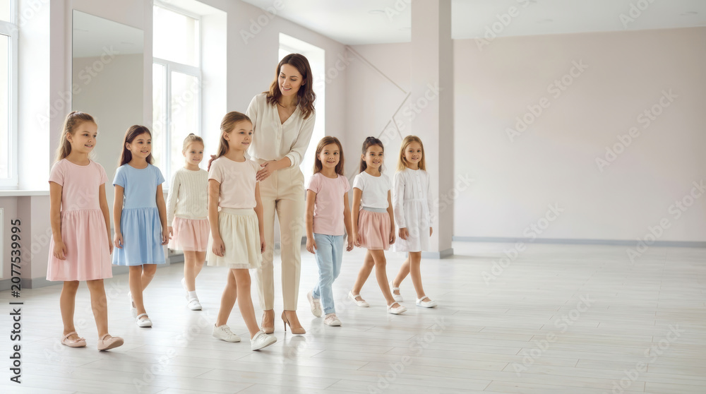 Fototapeta premium Girls at a modeling academy building confidence through practice