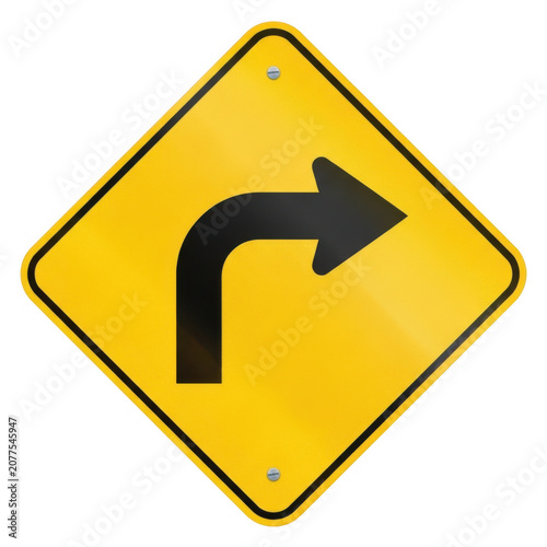 Yellow road sign showing sharp right turn arrow