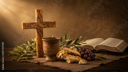 Christian communion symbols featuring a wooden cross, bread, wine, and bible