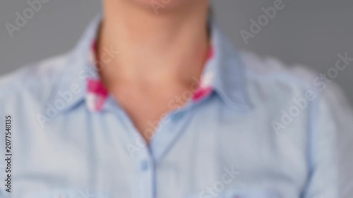 Close-up of a woman breaking a cigarette with her hands as a symbol of quitting smoking, tobacco cessation, healthy lifestyle, nicotine addiction recovery, and disease prevention.