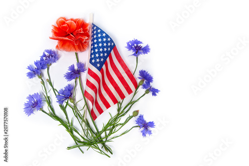 USA flag with red poppy and blue cornflowers on white background with space . Top view flat lay
