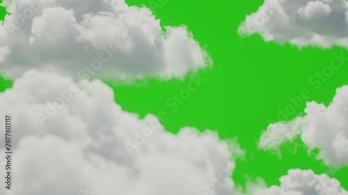 Aerial View of Fluffy White Clouds Moving Across Bright Green Sky During Daylight