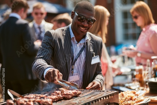 Businessman grilling meat at outdoor summer networking event