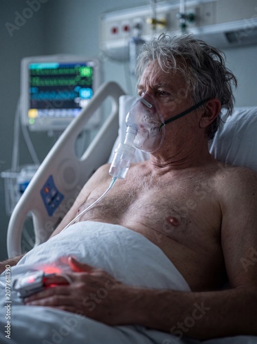 A medium shot in a hospital room of a patient with acute pneumonia, wearing a clear oxygen mask that fogs up with every short breath while a pulse oximeter on their finger emits a red light, professio