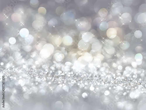 Sparkling silver bokeh background with glittering lights.