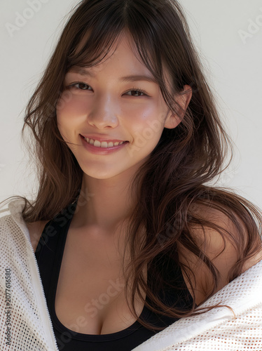 Natural beauty portrait of smiling Japanese woman with soft light, copy space