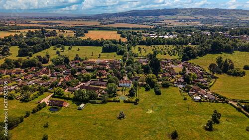 Wick village aerial view with traditional houses and surrounding countryside fields