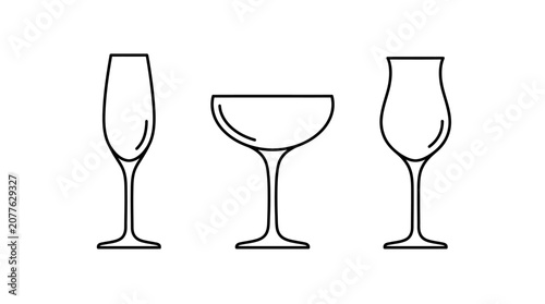 Three wine glasses on a table.