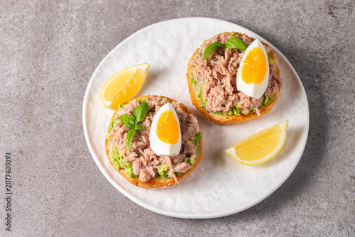 Toast with Canned Tuna. Fish open sandwich with egg and avocado. 