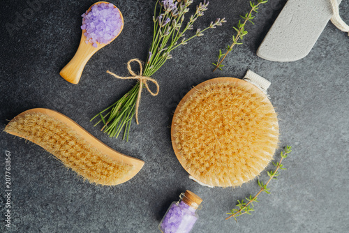 Photography Lavender sea salt and body brushes on a dark surface