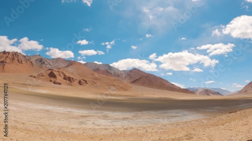 4K shot of Himalayan mountain peaks during the summer season in Ladakh, India. Scenic natural background of dry arid mountain range of Ladakh, Natural background with copy space. Scenic view.