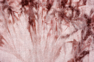 Close up of tie dye fabric texture with brown and white colors