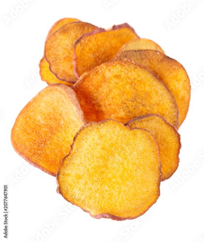 Crispy roasted sweet potato chips with sea salt, isolated on white background. Healthy and crunchy natural vegetable snack. Clipping path.