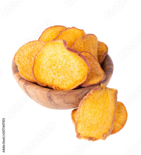 Crispy roasted sweet potato chips with sea salt, isolated on white background. Healthy and crunchy natural vegetable snack. Clipping path.