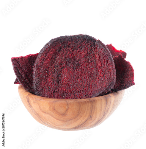 Crispy roasted beetroot chips with sea salt, isolated on white background. Healthy and crunchy natural vegetable snack. Clipping path.