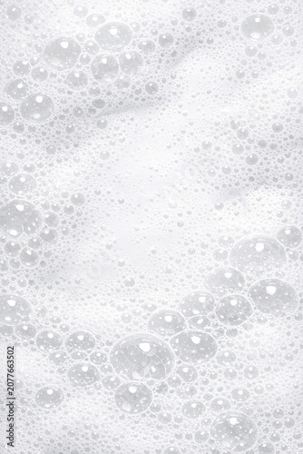 A lively scene with bubbles captured mid-air against the backdrop of sunlight