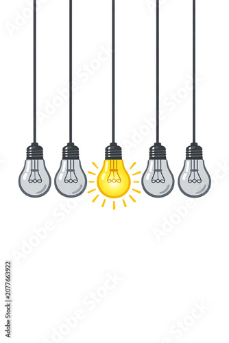The image depicts a collection of light bulbs hanging from cords. The central bulb is illuminated while the rest remain unlit. The concept symbolizes innovation and creativity.
