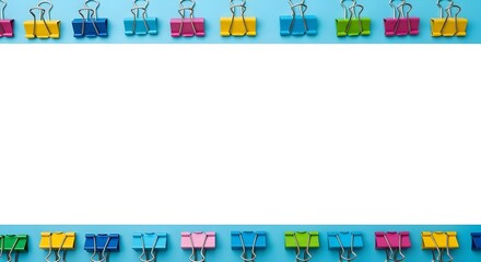 Colorful binder clips border on blue background with white copy space for school and business stationery design