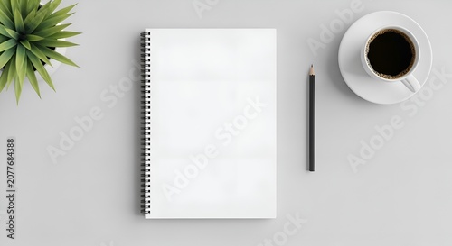 Blank Notebook with Coffee and Plant on White Desk - Overhead View