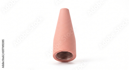 Macro of a single pink alumina ceramic TIG welding cup isolated on white background. Industrial fabrication hardware.